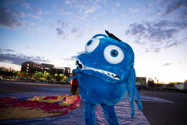 Infecto, the giant germ, waits to ride in a hot air balloon during the 5th annual Balloon Festival at Southern Hills Hospital, Friday Oct. 23, 2015. Infecto is used by Immunize Nevada to advocate for vaccines.