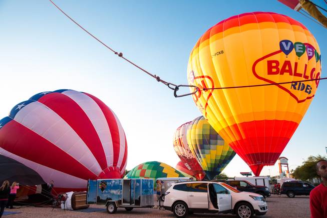 Hot air balloon crews prepare for an early morning launch during the 5th annual Balloon Festival at Southern Hills Hospital, Friday Oct. 23, 2015.