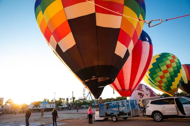Hot air balloons launch during the 5th annual Balloon Festival at Southern Hills Hospital, Friday Oct. 23, 2015.