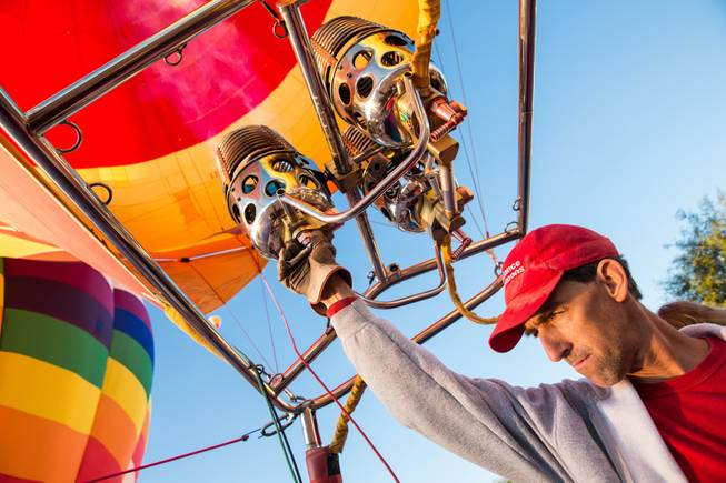 Commercial pilot Scott Nicol inflates an 8 passenger hot air balloon in preparation for launch at the 5th annual Balloon Festival at Southern Hills Hospital, Friday Oct. 23, 2015.