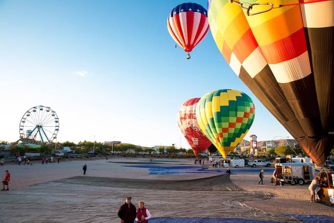 Hot air balloons launch during the 5th annual Balloon Festival at Southern Hills Hospital, Friday Oct. 23, 2015.