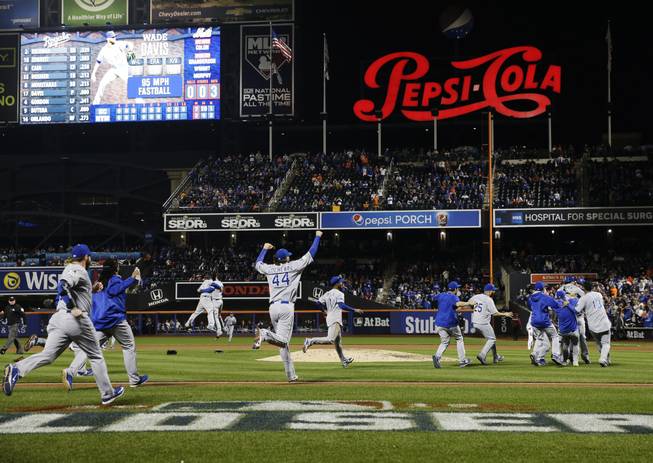 The Kansas City Royals celebrate after Game 5 of the World Series against the New York Mets on Monday, Nov. 2, 2015, in New York. The Royals won 7-2 to win the series. 
