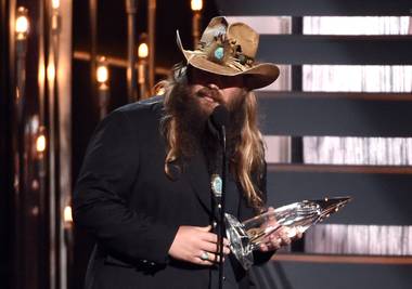 Chris Stapleton accepts the award for new artist of the year at the 49th Annual CMA Awards at Bridgestone Arena on Wednesday, Nov. 4, 2015, in Nashville, Tenn. 