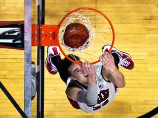 UNLV forward Stephen Zimmerman Jr., (33) drops in a backwards dunk over Whittier as the Rebels pull away in the first half during their game at the Thomas & Mack Center on Friday, Nov. 6, 2015.  