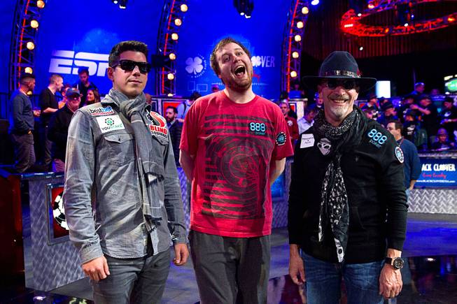 The final three players — Joshua Beckley of Marlton, N.J., Joe McKeehen of Philadelphia and Neil Blumenfield of San Francisco — stand after the second day of the World Series of Poker Main Event Final Table on Monday, Nov. 9, 2015, at the Rio.