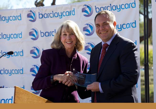 Kristin McMillan, CEO of the Las Vegas Metro Chamber of Commerce, is shown with Craig Peters, interim chief operations and technology officer for Barclaycard, at a ceremony marking the company's expansion in Henderson, Thursday, Nov. 12, 2015.