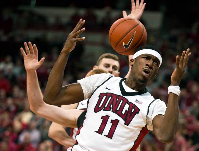 UNLV forward Goodluck Okonoboh (11) looks for a loose ball with Cal Poly players during their game at the Thomas & Mack Center on Friday, November 13, 2015.