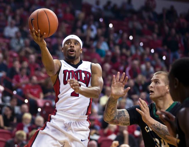 UNLV guard Jerome Seagears (2) gets a lane to the hoop past Cal Poly forward Brian Bennett (34) during their game at the Thomas & Mack Center on Friday, November 13, 2015.