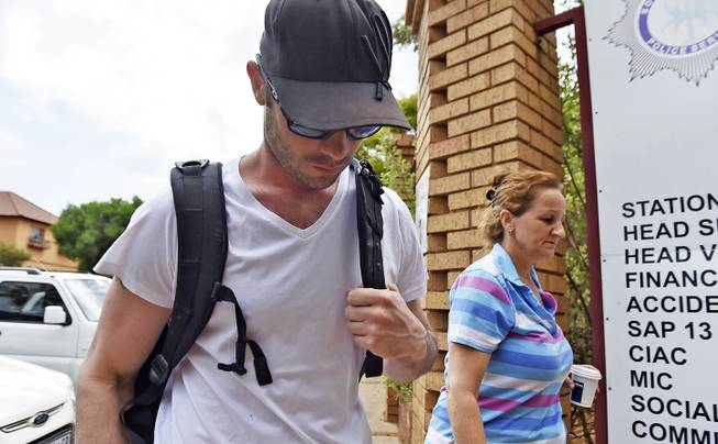 Oscar Pistorius reports for community service at the Garsfontein police station in Pretoria, South Africa, Saturday Nov. 14, 2015. Pistorius is under house arrest after serving a year of his five year prison sentence for the shooting death of his girlfrie