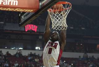 UNLV's Ike Nwamu dunks the ball during a game against New Mexico Highlands at the Thomas & Mack Center Monday, Nov. 16, 2015. 