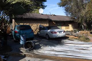 The exterior of a home is shown at 52 Sherrill Circle Tuesday, Nov. 17, 2015. The victims in a deadly fire Monday were restrained inside the house before it was intentionally set ablaze, according to Metro Police and Las Vegas Fire & Rescue officials.