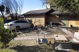 The exterior of a home is shown at 52 Sherrill Circle Tuesday, Nov. 17, 2015. The victims in a deadly fire Monday were restrained inside the house before it was intentionally set ablaze, according to Metro Police and Las Vegas Fire & Rescue officials.