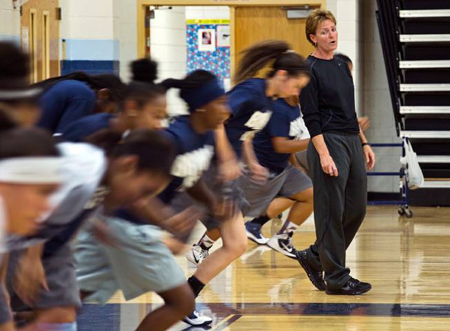 Centennial High School girls basketball coach Karen Weitz has her players run the court again for lack of hustle during practice on the first week of their season on Tuesday , November 17, 2015.