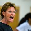 Centennial High School girls basketball coach Karen Weitz does her best to motivate her players during practice in the first week of their season.