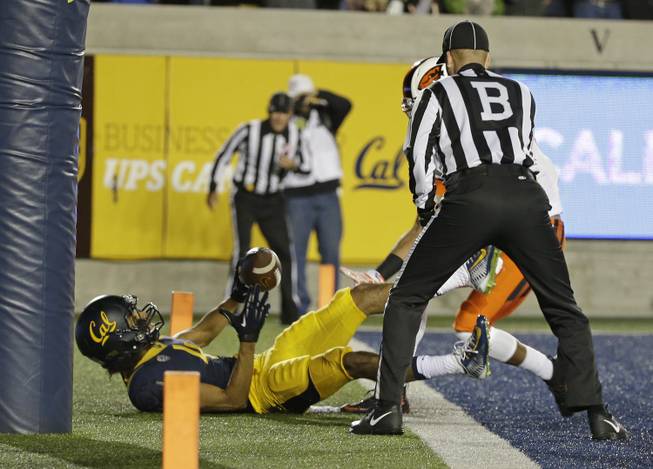 California wide receiver Kenny Lawler falls into the end zone after scoring a touchdown during the first half of an NCAA college football game against Oregon State Saturday, Nov. 14, 2015, in Berkeley, Calif.