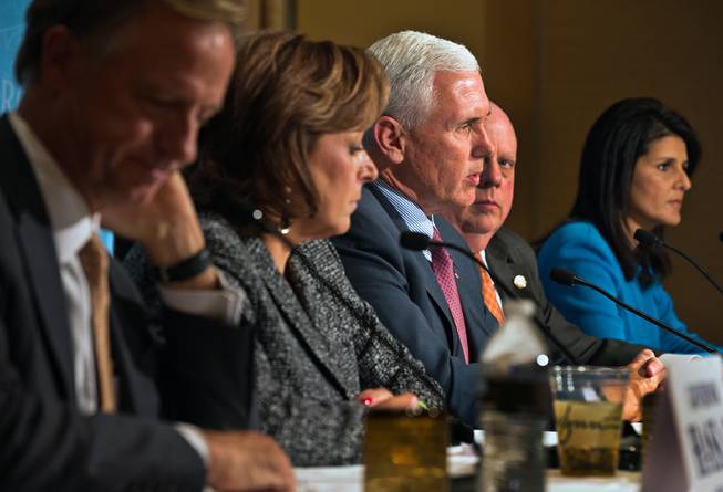 Gov. Mike Pence of Indiana speaks about the recent tragedy in Paris alongside other governors during a press briefing at the Encore Convention Center on Wednesday , November 18, 2015.