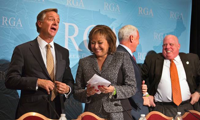 RGA Chair Gov. Bill Haslam of Tennessee and RGA Vice Chair Gov. Susana Martinez of New Mexico chat following a press briefing at the Encore Convention Center on Wednesday , November 18, 2015.