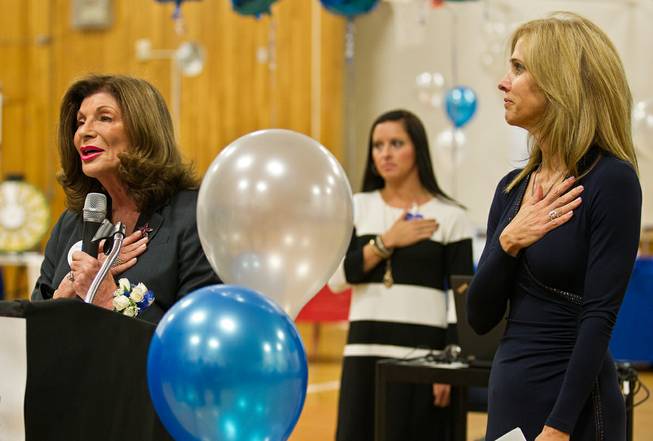 Former U.S. Rep. Shelley Berkley (left) leads the Pledge of Allegiance with Principal Ann Schiller (right) and others as the John C. Fremont Middle School celebrates its 60th anniversary on Thursday, November 19, 2015.