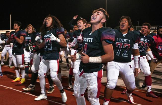 Liberty players perform their usual haka dance following a victory over Green Valley in their high school state quarterfinal game at Liberty, Friday, Nov. 20, 2015.
