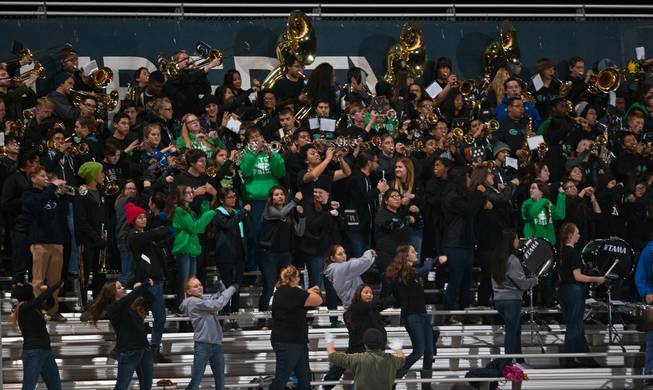 The Green Valley band and others play and dance as they battle Liberty in their high school state quarterfinal game at Liberty on Friday, November 20, 2015.