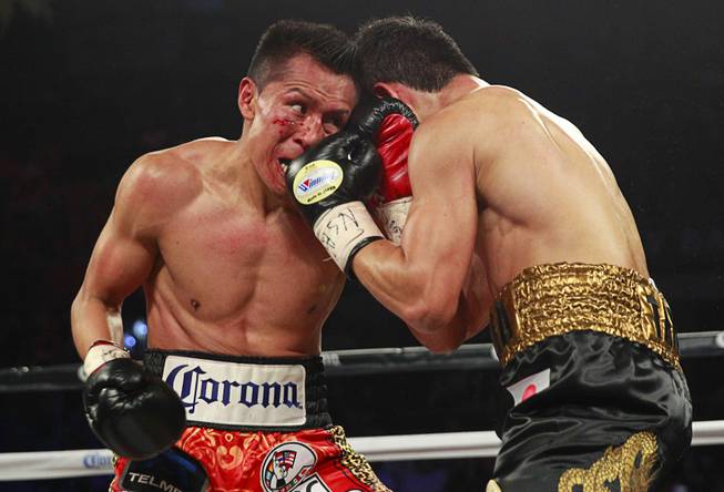 Francisco Vargas, left, of Mexico battles with WBC super featherweight champion Takashi Miura during their title fight at the Mandalay Bay Events Center Saturday, Nov. 21, 2015.