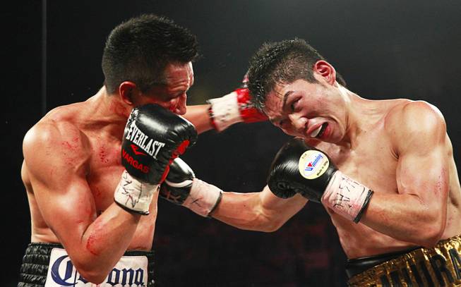 WBC super featherweight champion Takashi Miura, right, of Japan battles with Francisco Vargas of Mexico during their title fight at the Mandalay Bay Events Center Saturday, Nov. 21, 2015.