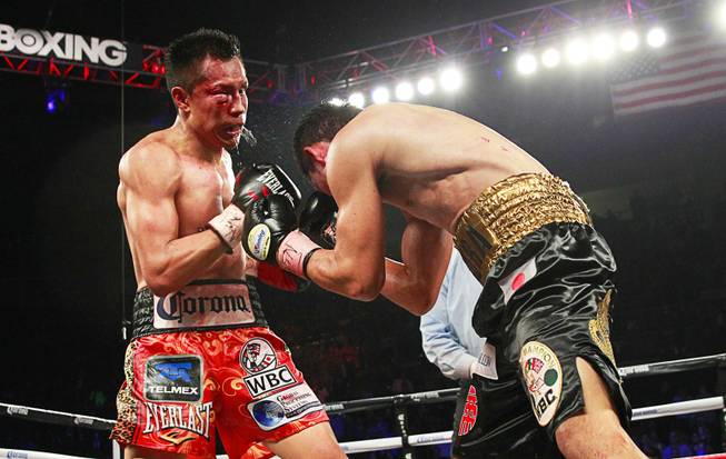 Francisco Vargas, left, of Mexico fights against WBC super featherweight champion Takashi Miura of Japan at the Mandalay Bay Events Center Saturday, Nov. 21, 2015.