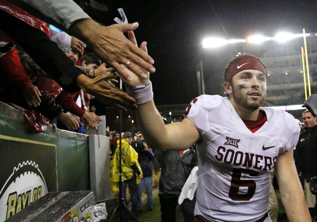 Oklahoma quarterback Baker Mayfield (6) greets fans after their NCAA college football game against Baylor, Saturday, Nov. 14, 2015, in Waco, Texas. Oklahoma won 44-34.