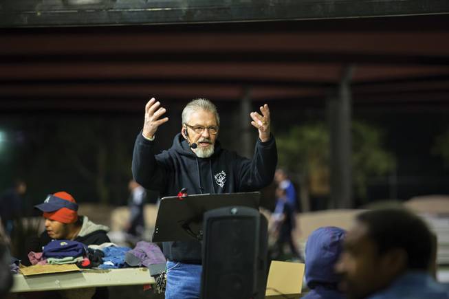 Cody Huff conducts a sermon during Bible study for the homeless at Justice Myron E. Leavitt and Jaycee Community Park. 