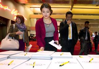 Students pick up pens and notebooks at the start of the 2015 Las Vegas Sun Youth Forum at the Las Vegas Convention Center Tuesday, Nov. 24, 2015.