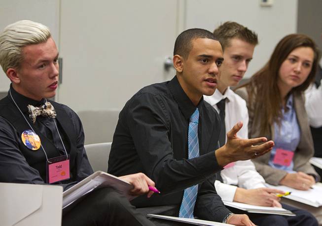 Brice Castro, center, of Cimarron-Memorial High School speaks on U.S. foreign policy during the 2015 Las Vegas Sun Youth Forum at the Las Vegas Convention Center Tuesday, Nov. 24, 2015.