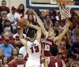 UNLV forward Ben Carter (13) shoots as Indiana forward Collin Hartman (30) defends in the first half in the Maui Invitational on Wednesday, Nov. 25, 2015, in Lahaina, Hawaii.