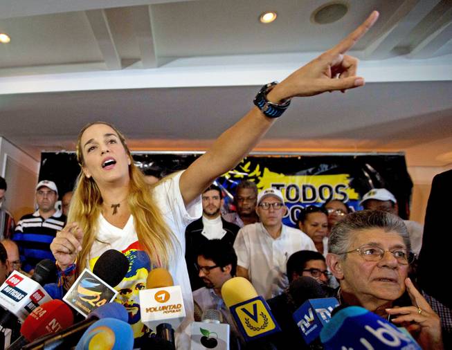 Lilian Tintori, wife of jailed opposition leader Leopoldo Lopez, speaks during a news conference in Caracas, Venezuela, Thursday, Nov. 26, 2015. An opposition leader was shot to death Wednesday while campaigning for next week's congressional elections in Venezuela.