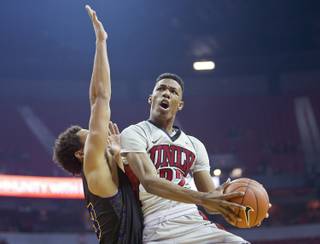 UNLV guard Patrick McCaw (22, right) looks to get off a shot over Prairie View forward Admassu Williams (23) at the Thomas & Mack Center on Saturday, November 28, 2015.