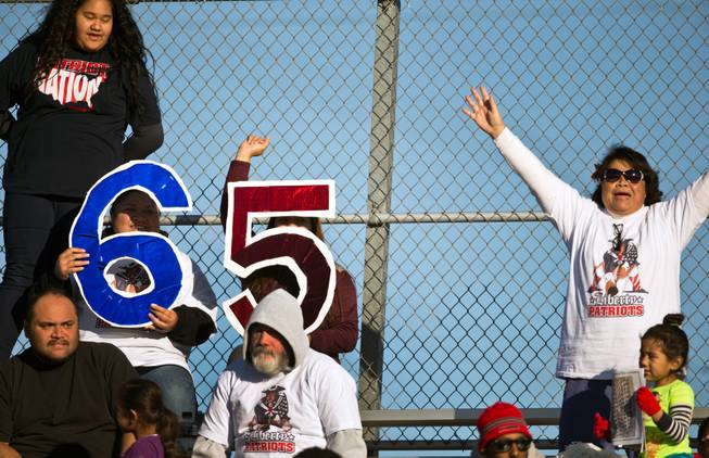 Liberty fans cheer for Tyus Toomalatai (65) playing late versus Basic during their high school state semifinals football game at Basic Academy of International Studies on Saturday, November 28, 2015.