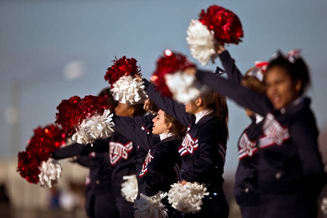 Liberty cheerleaders continue to keep their players and fans excited late in their high school state semifinals football game at Basic Academy of International Studies on Saturday, November 28, 2015.