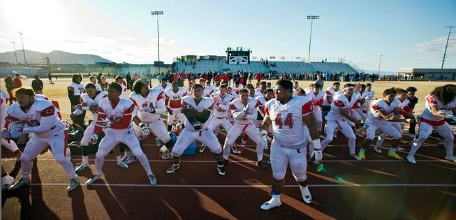 Liberty players do their traditional Haka dance after defeating Basic high school in their state semifinals football game at Basic Academy of International Studies on Saturday, November 28, 2015.