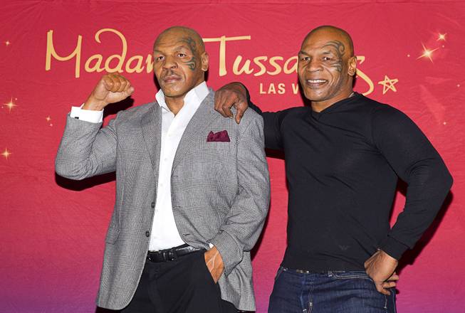 Former heavyweight boxing champion Mike Tyson, right, stands with the world’s first Mike Tyson wax figure during the figure’s unveiling Tuesday, Dec. 1, 2015, at Madame Tussauds Las Vegas. The figure is modeled after Tyson’s appearance as himself in “The Hangover.” The figure will be permanently displayed inside the attraction’s “The Hangover Experience” exhibit.