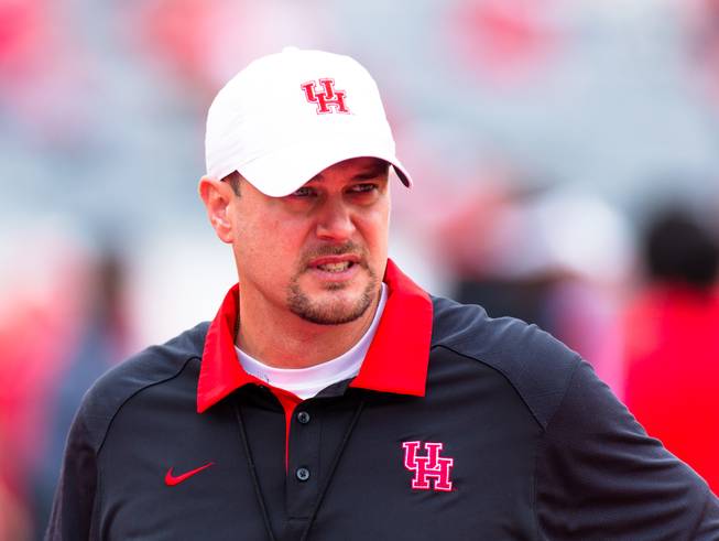 Houston's head coach Tom Herman on the field before an NCAA college football game between Houston and Navy Saturday, Nov. 27, 2015, in Houston, Texas. Houston defeated Navy 52-31.