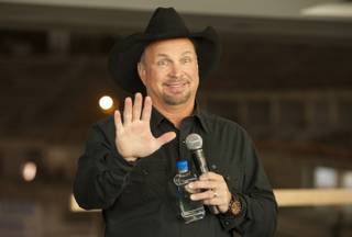 Country music superstar Garth Brooks talks to media Thursday, Dec. 3, 2015, as he announces his return to Las Vegas for exclusive performances at the new Las Vegas Arena still under construction and scheduled to open next April.
