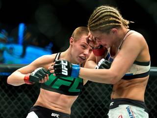 Women's Strawweight fighter Rose Namajunas connects to the head of Paige VanZant during the UFC Fight Night 80 at The Chelsea in the Cosmopolitan on Thursday, December 10, 2015. 