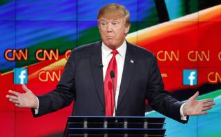 Donald Trump speaks during the CNN Republican presidential debate at the Venetian Hotel & Casino on Tuesday, Dec. 15, 2015, in Las Vegas. 