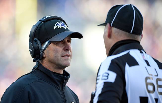 Baltimore Ravens head coach John Harbaugh, left, speaks with line judge Tom Stephan in the first half of an NFL football game against the Kansas City Chiefs on Sunday, Dec. 20, 2015, in Baltimore.