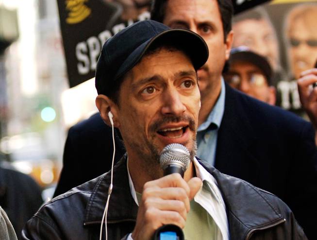 Former radio shock jock Anthony Cumia leaves CBS Radio studios on 57th Street with fans after finishing their first morning show April 26, 2006, in New York. Cumia, who hosted "Opie and Anthony," is facing charges over a fight with a woman at his New York home. He was arrested Saturday, Dec. 19, 2015, after the 26-year-old woman contacted authorities.