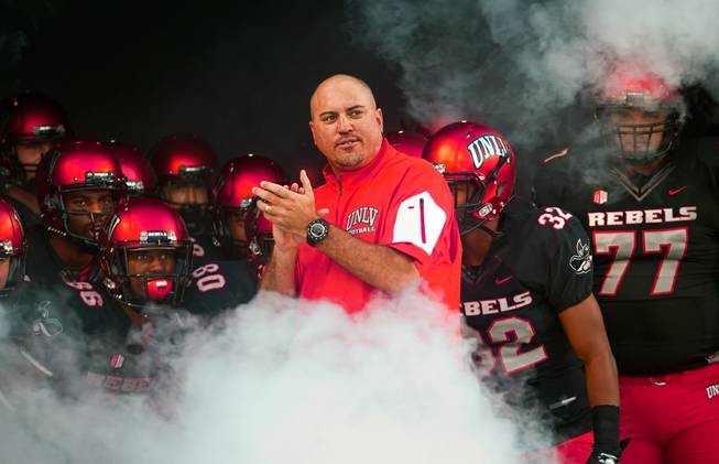 UNLV head coach Tony Sanchez and his players get ready in the tunnel to meet San Jose State on Saturday, Oct. 10, 2015, at Sam Boyd Stadium.