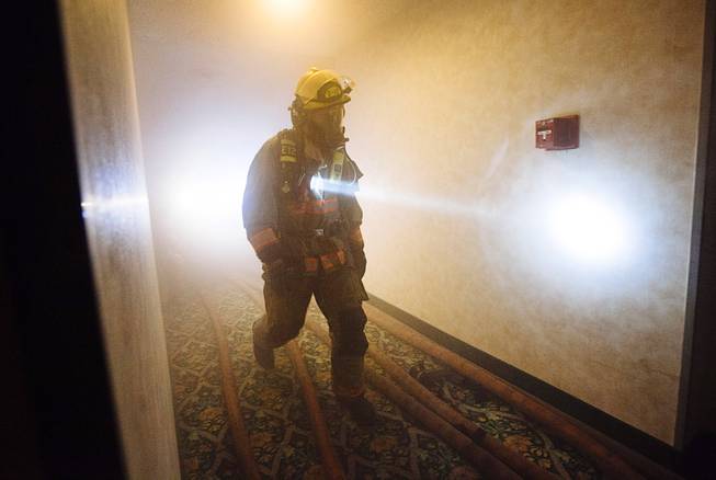 Clark County and Henderson fire fighters participate in a high-rise training scenario at the site of the Riviera Hotel in Las Vegas, Nev. on Aug. 10, 2015. .