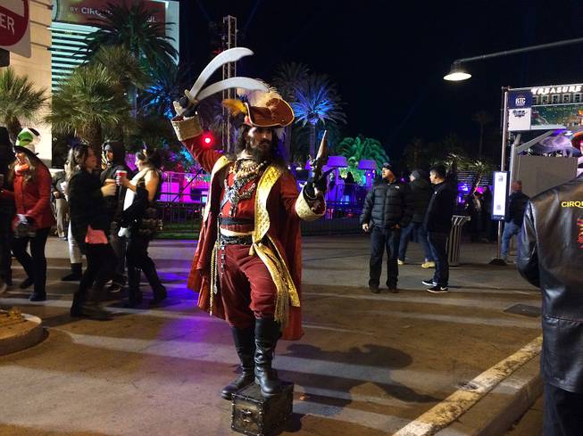 A street performer dressed as Captain Hook appears in front of the Mirage, Thursday, Dec. 31, 2015.