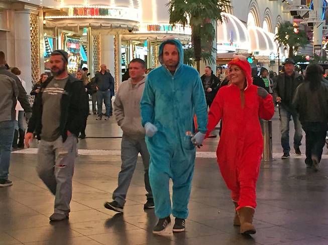 Christian Cage, 38, and Erika Torres, 31, were proud to display their "inner kid" Thursday night on Fremont Street, Thursday, Dec. 31, 2015.