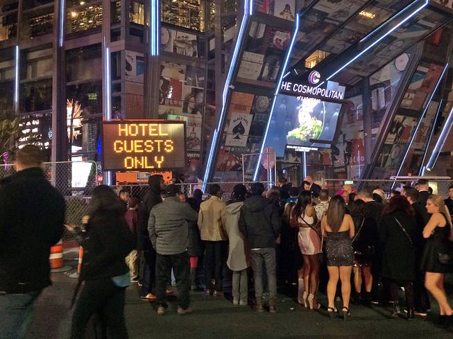 A crowd is shown in front of Cosmopolitan, where some are being turned away because the resort is only welcoming hotel guests, Thursday, Dec. 31, 2015.