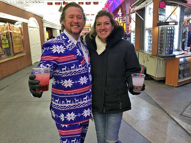 Las Vegan James Pooley is shown with his wife, Cindy, at the Fremont Street Experience on New Year's Eve, Thursday, Dec. 31, 2015.